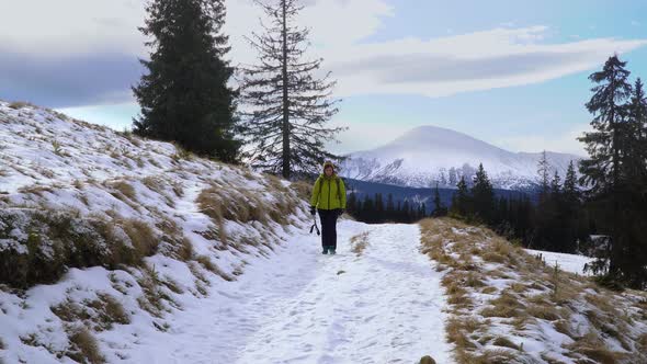A Woman Travels in the Mountains in Winter alt