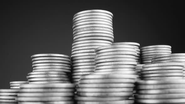 Stacks Of Coins Different Height Rotating In Front Of The Camera