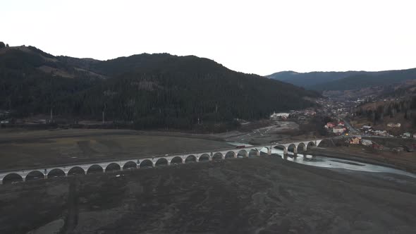 4k Drone Shot Over The Forest Bridge With Cars Passing Over