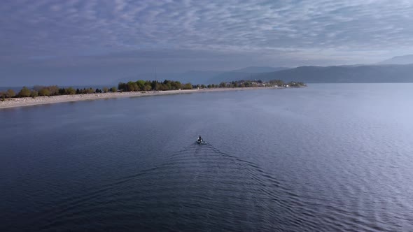 Ship is Swimming on the Egirdir Lake to Peninsula Filmed By Drone at Summer Day alt