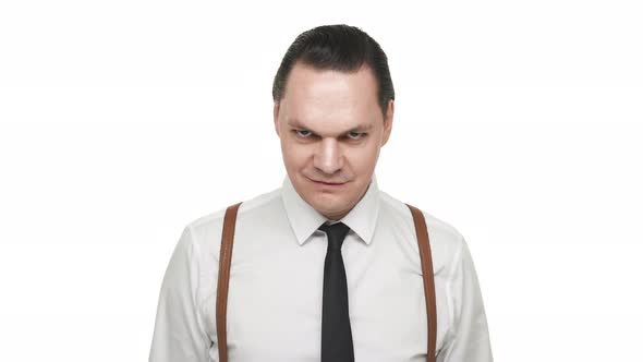 Portrait of Artistic Brunette Man Wearing Tie and Suspenders Grinning with Playful or Sarcastic alt