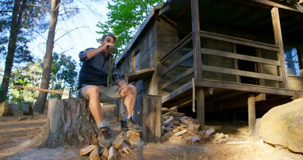 Male Logger Drinking Water in The Forest alt