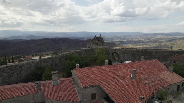 Ancient medieval walls of Sortelha town in Portugal. Aerial circling