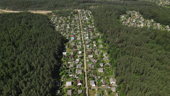 Bird'seye View of a Residential Village in the Middle of the Forest
