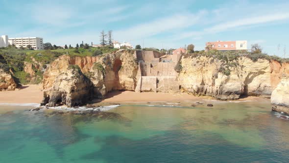 Pinhão Beach quiet cove with picturesque clear waters encircled by cliffs in Lagos, Algarve alt