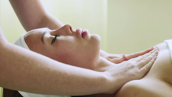 Young Woman Enjoys Facial Massage in Beauty Spa Salon on Wellness Treatment alt