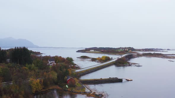 Famous Atlantic Ocean Road On A Foggy Day With Island In More og Romsdal, Norway. - aerial alt