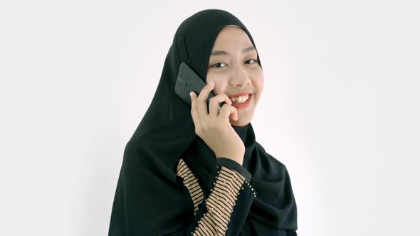Portrait of a Young Asian Muslim Woman alt