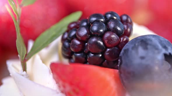 Macro Extreme Closeup Amazing Strawberry Blackberry and Blueberry Decorated with Sprig of Green alt