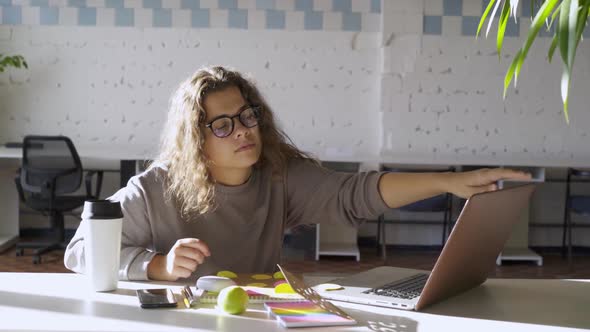 Exhausted Lady Working on Laptop Takes Off Glasses