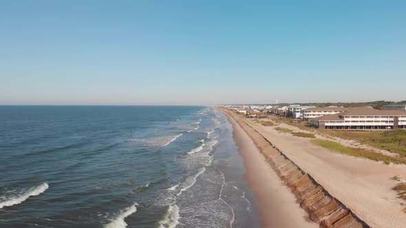 Rising drone shot of resorts and hotels on the beach in Oak Island NC alt