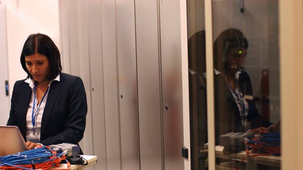 Technician working on laptop alt