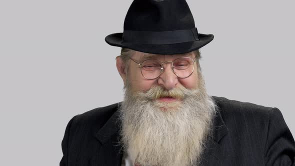Close Up Portrait Old Man with Long Beard Wearing Suit and Hat alt