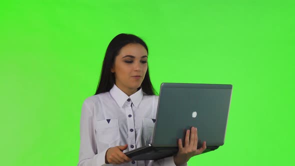Beautiful Businesswoman Video Chatting on Her Laptop alt