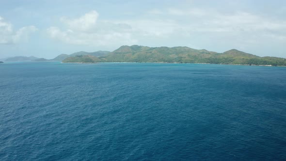 Aerial dolly over Indian ocean far from Praslin Island, Seychelles alt