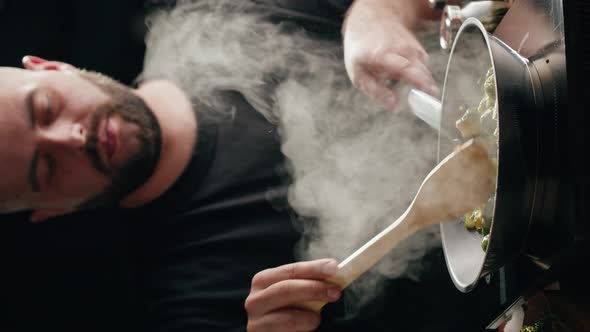 Vertical Video of Chef Frying Green Brussels Sprouts Cabbage in Pan Closeup alt