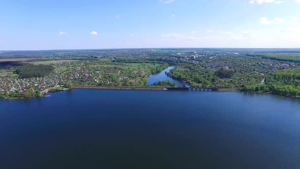 Dam blocking the river. Panoramic view of old dam near country alt