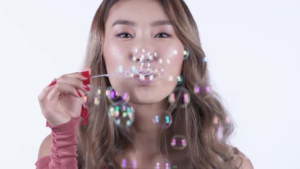 Pretty Woman Blowing Bubbles