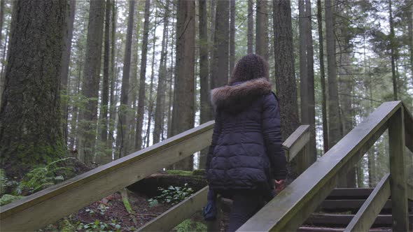 Girl Walking in the Canadian Rain Forest alt