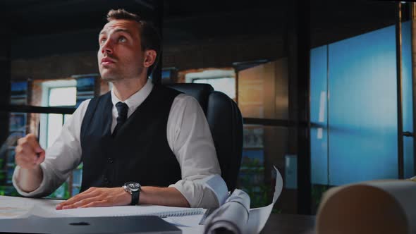 Male Architect Working Thinking in the Office on a Residential Building Project alt