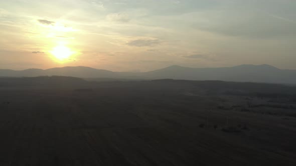 Mountains Stol and Deli Jovan under golden sky 4K aerial video alt
