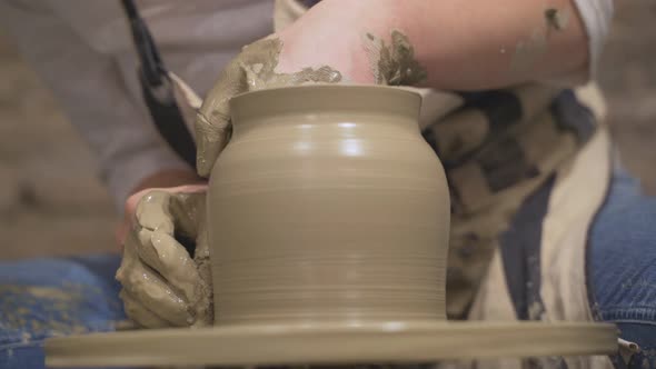 Potter Moulding Clay Jar