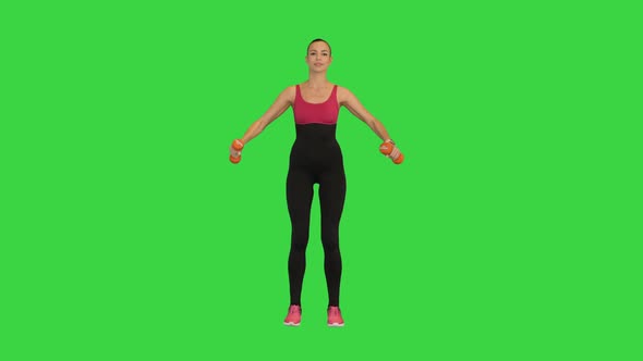 Fitness Girl Doing Exercise with Dumbbells on a Green Screen Chroma Key alt
