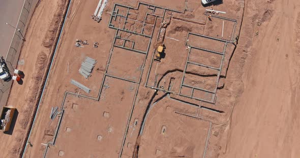 View of a Large Construction Site Where Earthmoving Equipment the Ground to Lay Pipes Residential alt