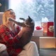 Smiling Beautiful Blonde Woman Playing with Grey Domestic Cat Sitting at Window - VideoHive Item for Sale