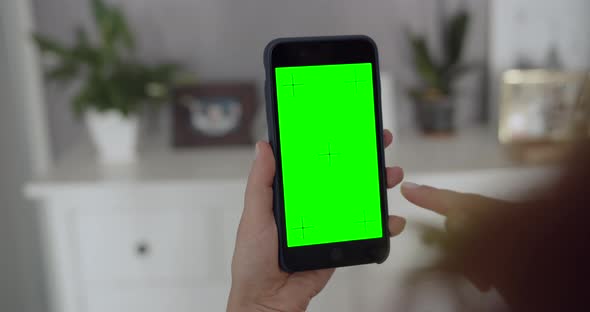 Woman Holding Greenscreen Smartphone