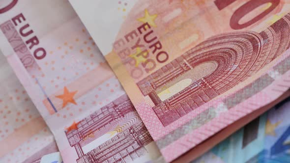 Shallow DOF European Union paper banknotes arranged for business background slow tilt 4K 2160p 30fps alt