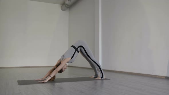 Female Yoga Trainer Works Out in Studio alt