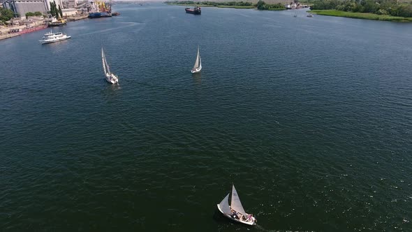 Aerial Shot of Sportive Yachts Going in the Dnipro River on a Sunny Day  