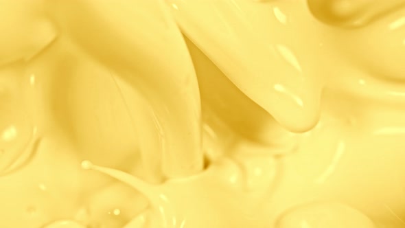 Super Slow Motion Shot of Pouring and Splashing Vanilla Milk at 1000Fps alt