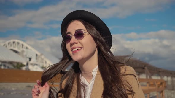 Stylish Young Brunnete Girl Walking on Beach alt