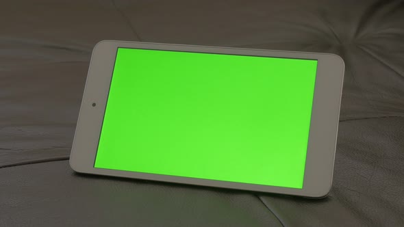 Greenscreen on tablet display for chroma effects 4K 2160p UHD footage - Tablet PC witg green screen  alt
