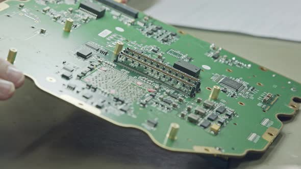 Close up of manual soldering of a large circuit board