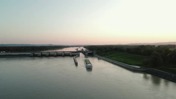 A cruise ship navigating out of a lock on the Danube in Austria. alt