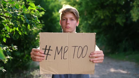 a Young Teenager of Caucasian Ethnicity a Man in a Blue Shirt Holds a Cardboard Box on Outstretched alt
