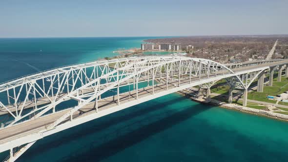Blue Water Bridge connecting Port Huron, Michigan USA and Sarnia, Ontario Canada with droneing down. alt