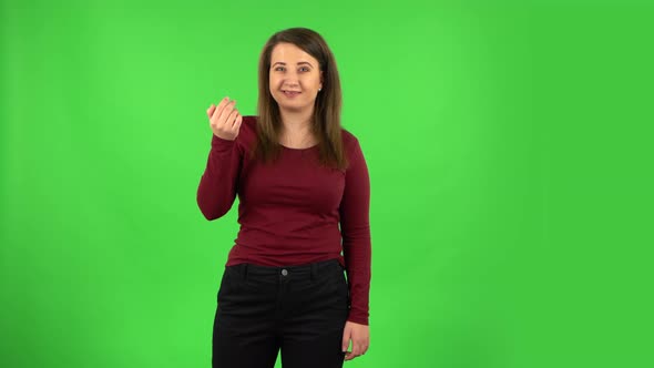 Pretty Girl Waving Hand and Showing Gesture Come Here. Green Screen alt