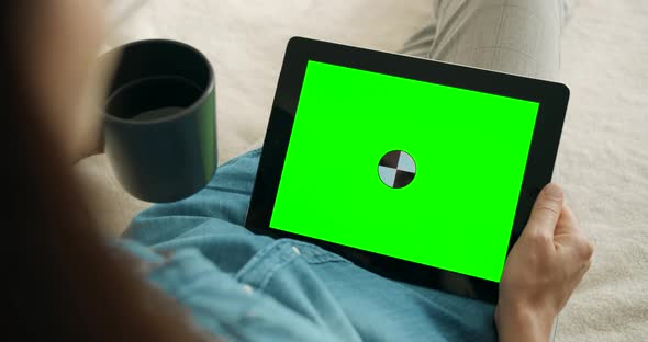 Woman Holding Greenscreen Tablet