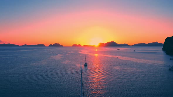 Sail Boats at Sunset on the Sea Lagoon on Corong Beach in El Nido, Palawan, Philippines alt