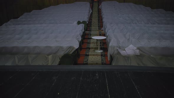 Old Theater is Empty During the Coronavirus Pandemic View From the Stage to Stairs and Blank Seats alt