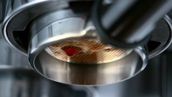 Super Slow Motion Macro Shot of Dripping Fresh Espresso Coffee From Lever Machine at 1000 Fps alt