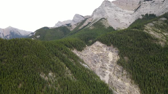 Aerial cinematic view of the Kananaskis Mountain Range in the Canadian Rockies. Drone 4K footage of alt