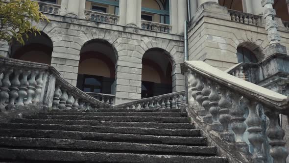 An Old Abandoned Marble Staircase with a Lift Up To the Mansion alt