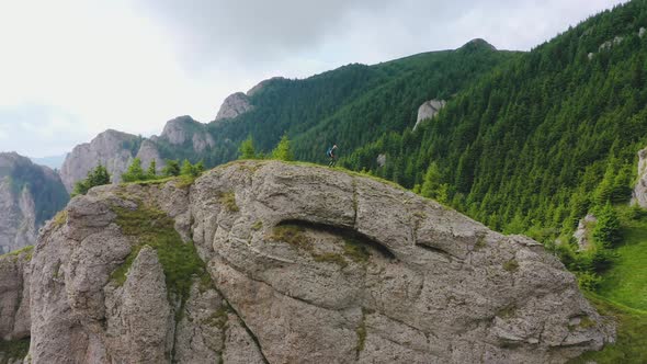 Man Climbing on the Rock