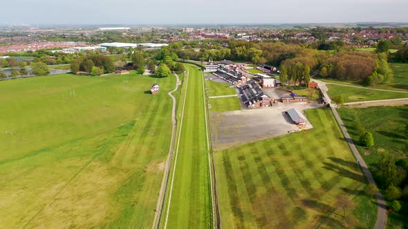 Aerial footage of the Pontefract race course located in the town of Pontefract in West Yorkshire alt