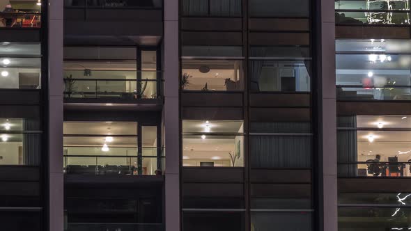 Big Glowing Windows in Modern Office and Residential Buildings Timelapse at Night alt